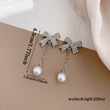 1 Pair Elegant Romantic Bow Knot Plating Inlay Alloy Artificial Rhinestones Artificial Pearls White Gold Plated Drop Earrings