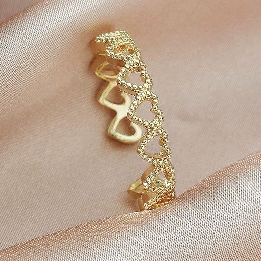 Wholesale Women's Copper Heart Shaped Hollow Love Stitching Electroplated Ring
