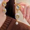 1 Pair Elegant Retro Water Droplets Plating Inlay Alloy Imitation Pearl Resin Rhinestones Drop Earrings