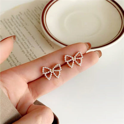 Simple Style Bow Knot Inlaid Pearls Alloy No Inlaid Earrings Ear Studs