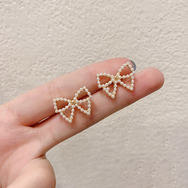 Simple Style Bow Knot Inlaid Pearls Alloy No Inlaid Earrings Ear Studs