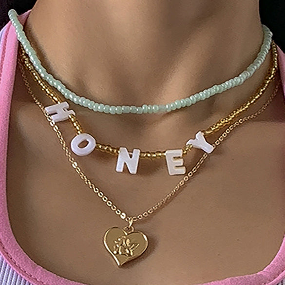 Alloy Bead Letter Stacked Heartshaped Pendant Collarbone Necklace For Women With Geometric Pattern And Electroplating Treatment