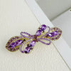 Alloy Crystal Spring Hairpin For Women With Bow Design And Electroplating Processing