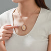 Alloy Electroplated Geometric Oval Pendant Necklace For Women With Inlaid Zircon And Character Statue