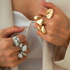 Alloy Geometric Hollow Twist Hug Ring For Women With Electroplating