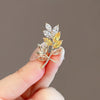 Alloy Leaves Rice Flower Brooch For Women With Electroplating Process And Antislip Buckle