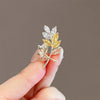 Alloy Leaves Rice Flower Brooch For Women With Electroplating Process And Antislip Buckle