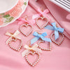 Alloy Pearl Inlaid Heart Shape And Bow Tie Earrings For Women