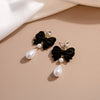 Alloy Retro Red Flocking Bow Pearl Earrings With Electroplating For Women