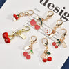 Cherry Pendant Keychain Jewelry For Women Made Of Metal And Crystal Resin With Dripping Oil Processing And Fruit Pattern