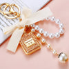 Cute Creative Pearl Bow Perfume Bottle Shaped Metal Keychain For Women As Bag Pendant Or Key Ring Diamond Gifts