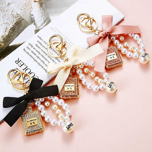 Cute Creative Pearl Bow Perfume Bottle Shaped Metal Keychain For Women As Bag Pendant Or Key Ring Diamond Gifts