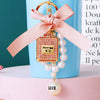 Cute Creative Pearl Bow Perfume Bottle Shaped Metal Keychain For Women As Bag Pendant Or Key Ring Diamond Gifts