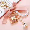 Cute Creative Pearl Bow Perfume Bottle Shaped Metal Keychain For Women As Bag Pendant Or Key Ring Diamond Gifts
