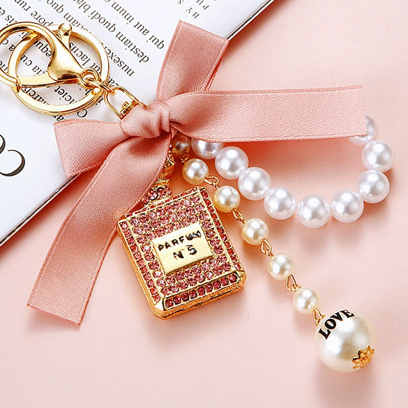 Cute Creative Pearl Bow Perfume Bottle Shaped Metal Keychain For Women As Bag Pendant Or Key Ring Diamond Gifts