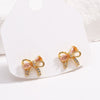 Cute Pink Diamond Zircon Bow Women's Earrings Copper Electroplated 18K Real Gold