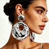 Electroplated Alloy Hollow Round Pendant Earrings With Irregular Wave Pattern And Geometric Statement Design