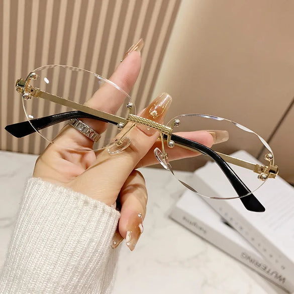 Elegant Simple Style Solid Color Pc Tinted Lenses Oval Frame Frameless Women'S Sunglasses