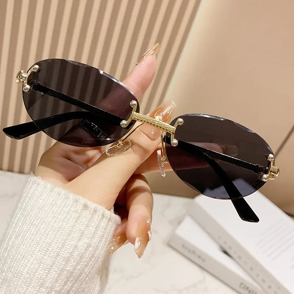 Elegant Simple Style Solid Color Pc Tinted Lenses Oval Frame Frameless Women'S Sunglasses
