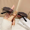Elegant Simple Style Solid Color Pc Tinted Lenses Oval Frame Frameless Women'S Sunglasses