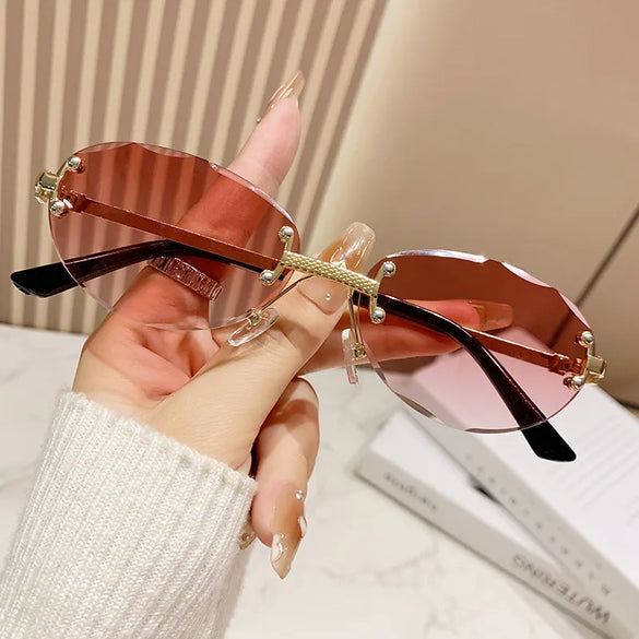 Elegant Simple Style Solid Color Pc Tinted Lenses Oval Frame Frameless Women'S Sunglasses