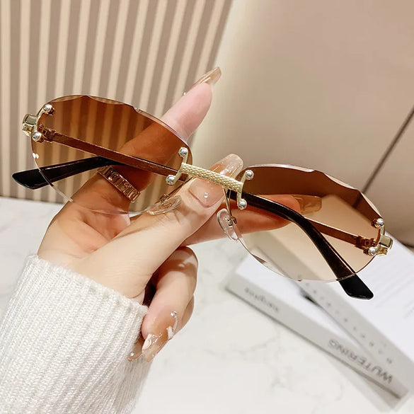 Elegant Simple Style Solid Color Pc Tinted Lenses Oval Frame Frameless Women'S Sunglasses