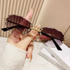 Elegant Simple Style Solid Color Pc Tinted Lenses Oval Frame Frameless Women'S Sunglasses