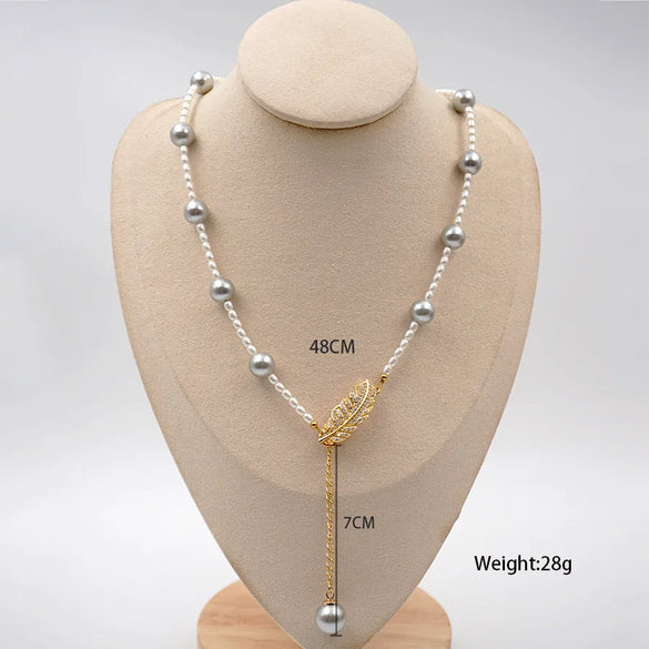 Elegant Vintage Style Vacation Feather Imitation Pearl Titanium Steel Copper Beaded Plating Inlay Zircon Gold Plated New Year Birthday Women'S Pendant Necklace