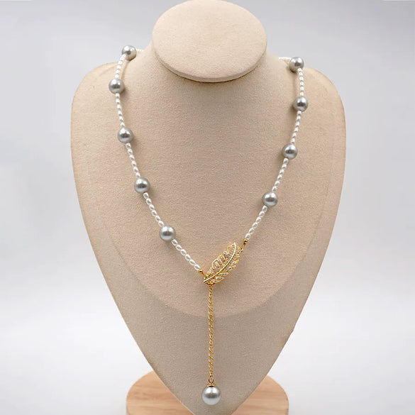 Elegant Vintage Style Vacation Feather Imitation Pearl Titanium Steel Copper Beaded Plating Inlay Zircon Gold Plated New Year Birthday Women'S Pendant Necklace