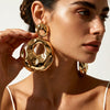 Exaggerated Hollow Round Pendant Earrings With Irregular Wave Pattern Electroplated Iron Alloy Geometric Statement Jewelry With Stainless Steel Ear Posts