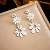Fashion Simple Creative Gold Plated Stainless Steel Floret Opening Pendant Titanium Steel Earrings Sweet Style Geometric Pattern Electroplated