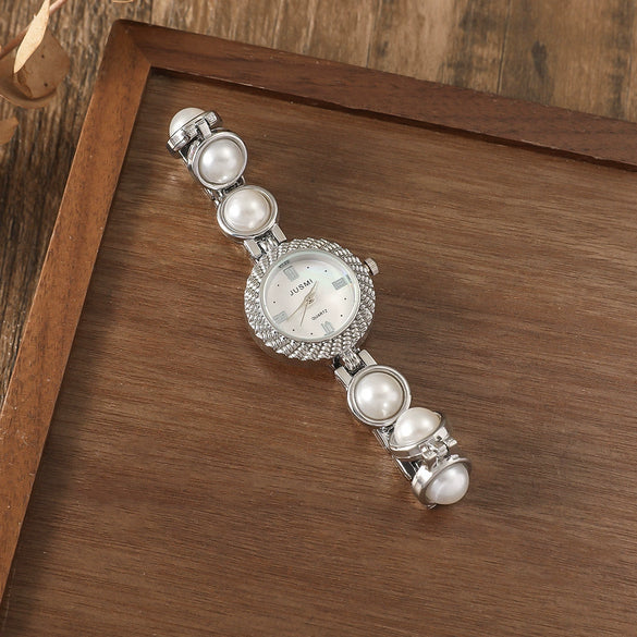 Fashionable Alloy Case Stainless Steel Strap Oval Dial Women's Pearl Thin Belt Fritillary Quartz Watch With Spiral Crown And Ordinary Glass Mirror