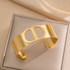Fashionable Wide Titanium Steel C Shaped Opening Bracelet With Cd Letter Design 18K Gold Plated Polished Vacuum Furnace Electroplated Anti Allergic And Color Preserving