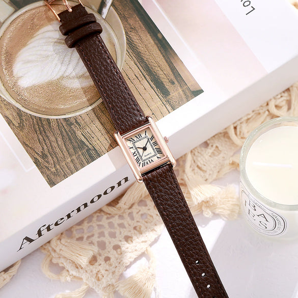Female Leisure Quartz Watch With Alloy Case Imitation Leather Strap And Round Dial