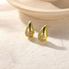 Geometrically Irregular Twisted C Shaped Unisex Earrings In Copper With Zirconia Design
