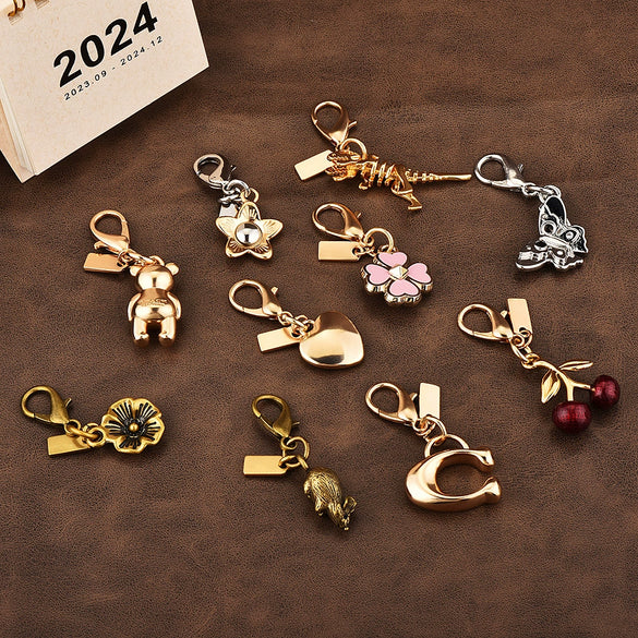 Gold Electroplated Car Key Pendant With Bear Cherry Fourleaf Clover And Butterfly Patterns For Schoolbag Jewelry Wholesale