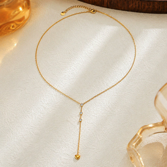 Gold Plated Stainless Steel Heart Geometric Pendant Necklace For Women With Decorative Tassel Detail