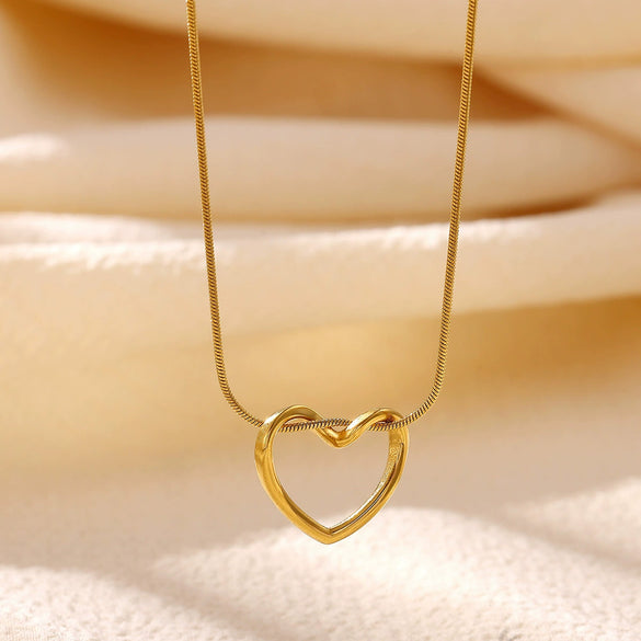 Gold Plated Titanium Steel Hollow Heart Pendant Snake Chain Necklace For Women Minimalist Versatile Jewelry Design