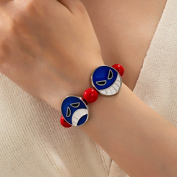 Handmade Alloy Beaded Bracelet With Cartoon Crying Face Pendant Red Beads And Geometric Oil Drip Design For Unisex Wear