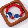 Handmade Alloy Beaded Bracelet With Cartoon Crying Face Pendant Red Beads And Geometric Oil Drip Design For Unisex Wear