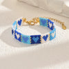 Handwoven Glass And Stainless Steel Heart Bracelet With Colorful Checkered Pattern