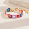 Handwoven Glass And Stainless Steel Heart Bracelet With Colorful Checkered Pattern