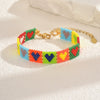 Handwoven Glass And Stainless Steel Heart Bracelet With Colorful Checkered Pattern