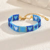 Handwoven Glass And Stainless Steel Heart Bracelet With Colorful Checkered Pattern