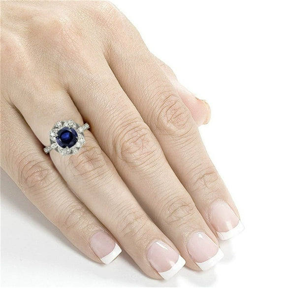 Ladies Copper Ring With Hollow Flower And Blue Zircon Inlay Geometric Style