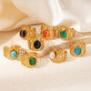 Ladies Titanium Steel Hollow Wide Face Retro Geometric Opening Ring Inlaid With Oval Natural Stone Electroplated
