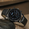 Men's Alloy Case Imitation Leather Strap Quartz Watch With Round Dial And Printed Logo Gear Dial Design Pin Buckle Plain Crown Ordinary Glass Mirror