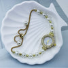 Pearl Alloy Women's Round Dial Fashionable Bracelet Watch With Spiral Crown And Stainless Steel Onepiece Buckle