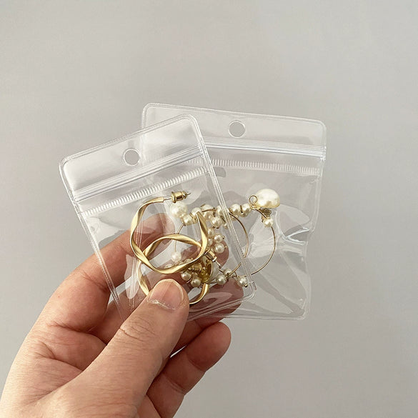 Portable Transparent Perforated Jewelry Earring And Necklace Hanging Storage Bag For Household Use