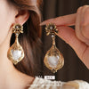 Retro Light Luxury Women's Alloy Pendant Imitation Pearl Earrings With Silver Needle Diamond Flower Pattern And Electroplating Design
